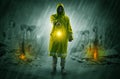 Man with a glowing lantern at a catastrophe scene Royalty Free Stock Photo