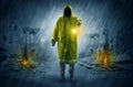 Man with a glowing lantern at a catastrophe scene Royalty Free Stock Photo