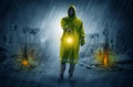 Man with a glowing lantern at a catastrophe scene Royalty Free Stock Photo