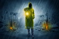 Man with a glowing lantern at a catastrophe scene Royalty Free Stock Photo