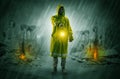 Man with a glowing lantern at a catastrophe scene Royalty Free Stock Photo