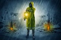 Man with a glowing lantern at a catastrophe scene Royalty Free Stock Photo