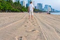 Man goes away on beach and he leaves footprints on sand Royalty Free Stock Photo