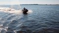 The man goes for a drive on a water motorcycle Royalty Free Stock Photo