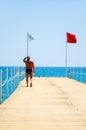 Man goes to the green pier to dive