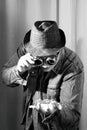 A man in goggles looks at the spider sitting on his arm, steampunk style, black and white photo Royalty Free Stock Photo
