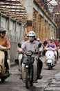 Man going across Long Bien steel bridge in Hanoi