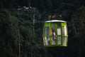 A man is going through the Combeima Canon in a cable car, Colombia.