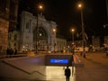 Man going down the stairs of a metro Station in front of Budapest Keleti Palyaudvar train station at night Royalty Free Stock Photo