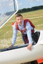 Man going inside glider aircraft Royalty Free Stock Photo