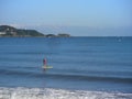 Hendaye, New Aquitaine/France; 08 17 2014: Man going into the sea doing paddle surfing.