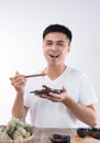 A man is going to eat delicious zongzirice dumpling on Dragon Boat Festival, Asian traditional food Royalty Free Stock Photo