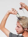 Man going to shave his long hair Royalty Free Stock Photo