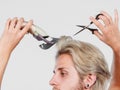 Man going to shave his long hair Royalty Free Stock Photo