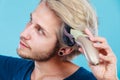 Man going to shave his long hair Royalty Free Stock Photo