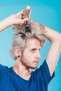 Man going to shave his long hair Royalty Free Stock Photo