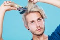 Man going to shave his long hair Royalty Free Stock Photo