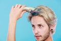 Man going to shave his long hair Royalty Free Stock Photo