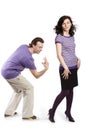 Man going to smack with fingers on back of woman Royalty Free Stock Photo