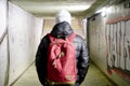 Man going in underpass. Graffiti in subway. Royalty Free Stock Photo