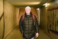 Man going in underpass. Graffiti in subway. Royalty Free Stock Photo