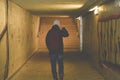 Man going in underpass. Graffiti in subway. Royalty Free Stock Photo