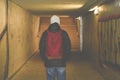 Man going in underpass. Graffiti in subway. Royalty Free Stock Photo