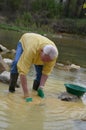 Man with gold pan Royalty Free Stock Photo