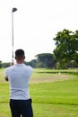 Man, golfer and back with club on golf course for game, match or outdoor sport on green grass or field in nature. Rear Royalty Free Stock Photo