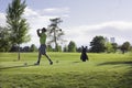 Man golfing at City Park, Denver, Colorado Royalty Free Stock Photo