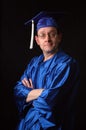 Man With Graduation Gown and Cap Royalty Free Stock Photo