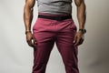 A Man In A Gray Shirt And Pink Pants