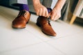 The man in gray slacks and a purple dress socks brown shoes with Royalty Free Stock Photo