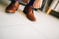 The man in gray slacks and a purple dress socks brown shoes with Royalty Free Stock Photo