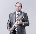 Man in a gray suit with a trumpet Royalty Free Stock Photo