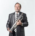 Man in a gray suit with a trumpet Royalty Free Stock Photo