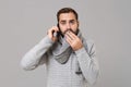 Man in gray sweater isolated on grey background. Healthy lifestyle ill sick disease treatment cold season concept. Mock