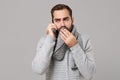 Man in gray sweater isolated on grey background. Healthy lifestyle ill sick disease treatment cold season concept. Mock