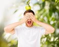 Man with green apple on his head Royalty Free Stock Photo