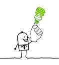 Man with green bulb on finger Royalty Free Stock Photo