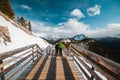 A man with a green jacket on Sulphur mountain at Banff, Canada