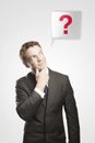 Man with green question mark above his head Royalty Free Stock Photo