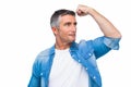 Man with grey hair tensing arm muscle