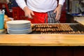 Man grill hot dogs in the shop in Germany Royalty Free Stock Photo