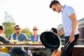 Man grilling on bbq at rooftop party