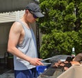 Man Grilling Food on BBQ Grill