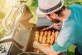 Portrait of man grilling and having a garden barbecue party