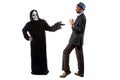 Man in Grim Reaper Ghost Costume Playing a Prank on Halloween