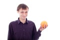 Man grimace holding sour fruit