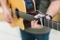 Man guitar player on acoustic guitar Royalty Free Stock Photo